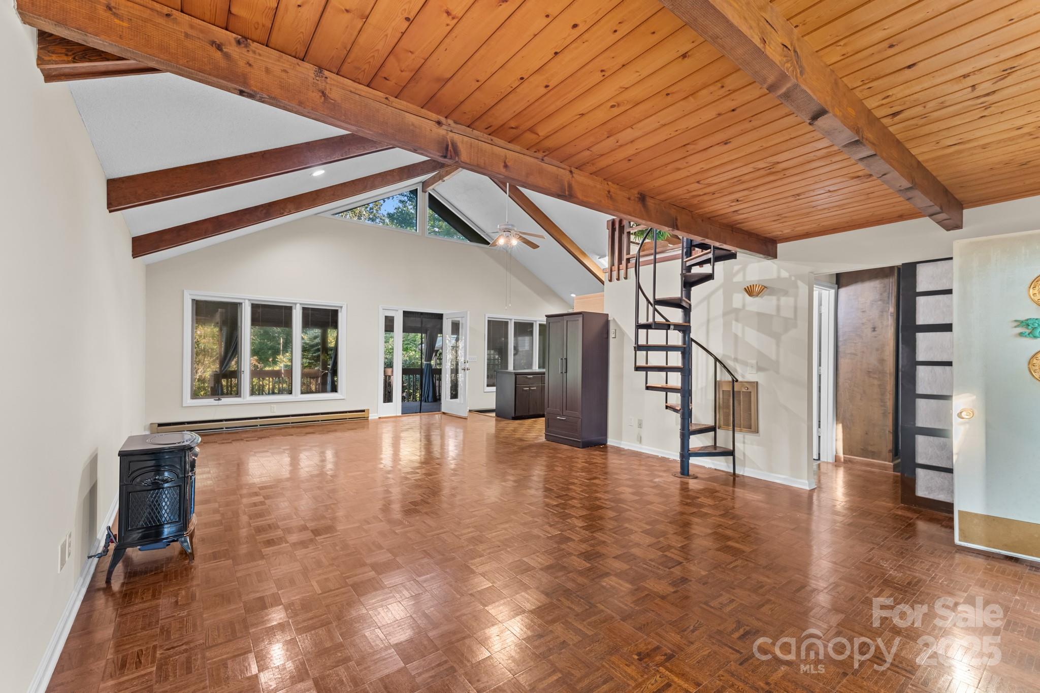 33 Summit Lane Newland, NC 28657 - Photo 32 of 48 a view of an empty room with a window and wooden floor