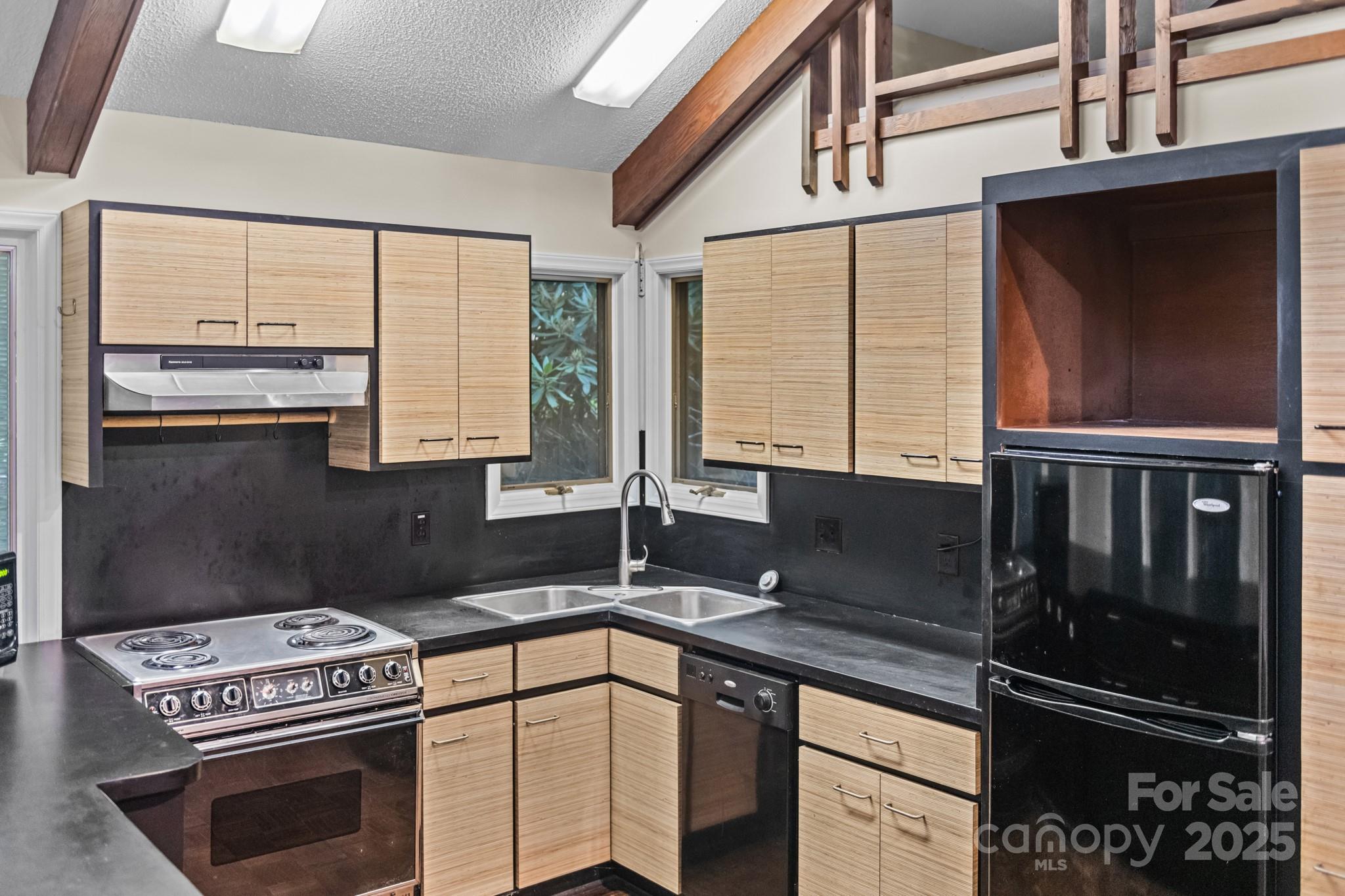 33 Summit Lane Newland, NC 28657 - Photo 37 of 48 a kitchen with a sink a stove and cabinets