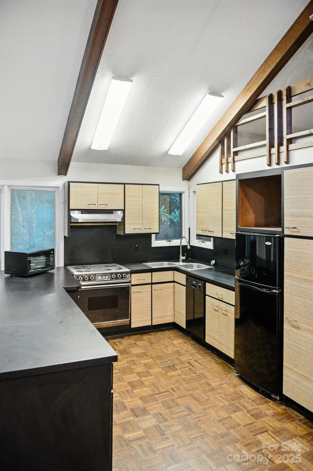 33 Summit Lane Newland, NC 28657 - Photo 38 of 48 a kitchen with stainless steel appliances kitchen island granite countertop a stove a sink and a microwave