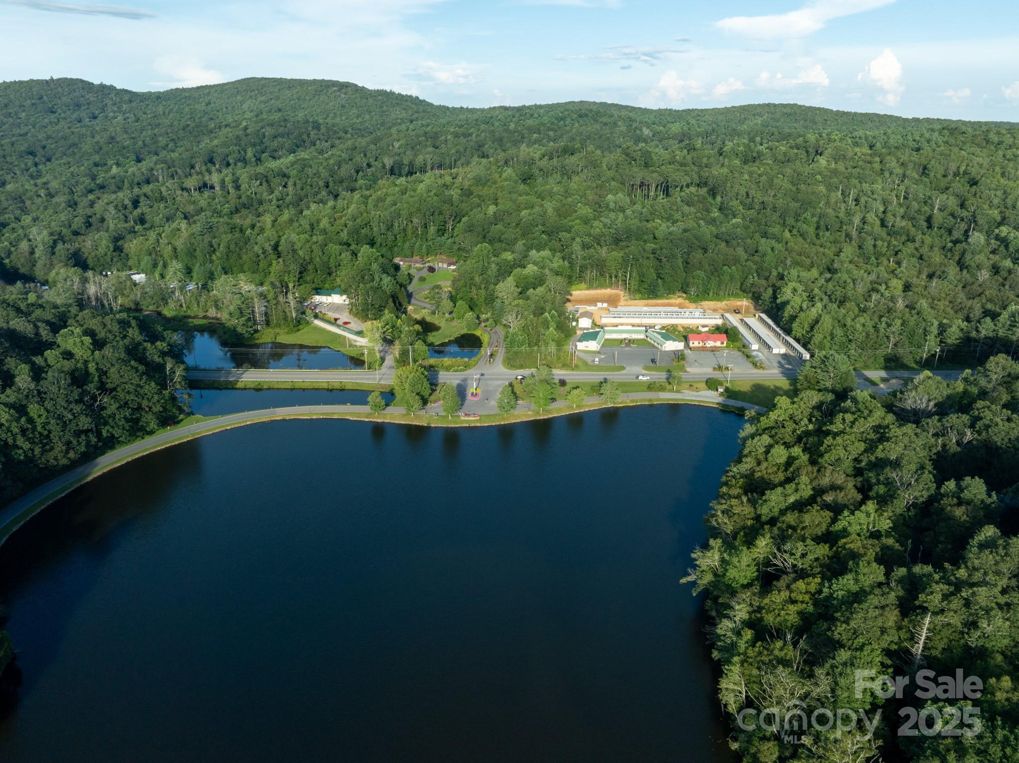 33 Summit Lane Newland, NC 28657 - Photo 4 of 48 a view of a lake with a mountain in the background