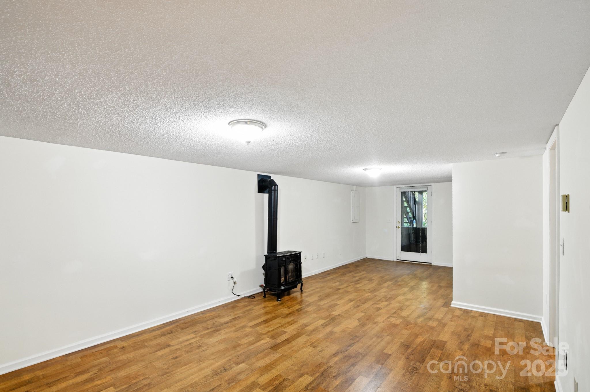 33 Summit Lane Newland, NC 28657 - Photo 41 of 48 a view of an empty room with wooden floor