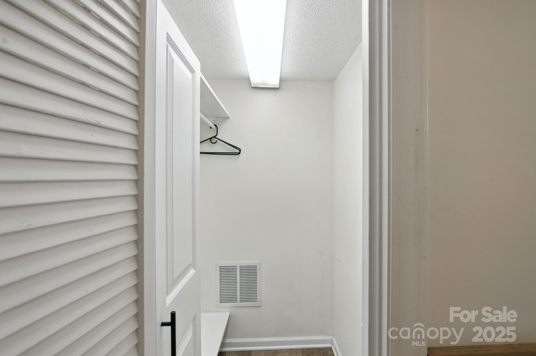 33 Summit Lane Newland, NC 28657 - Photo 42 of 48 a view of staircase with white walls and white door