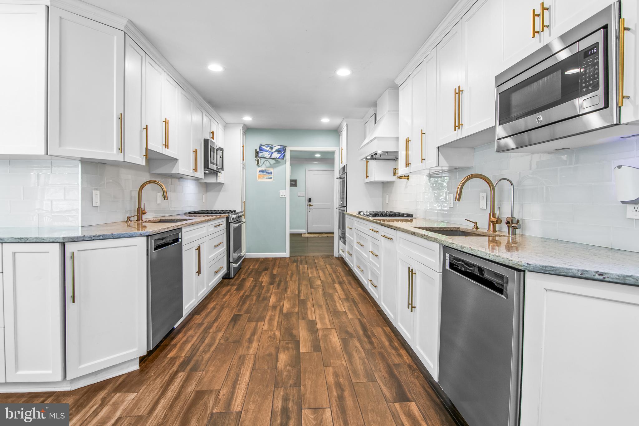 6308 Ivymount Road Baltimore, MD 21209 - Photo 5 of 22 a kitchen with stainless steel appliances granite countertop a sink and cabinets