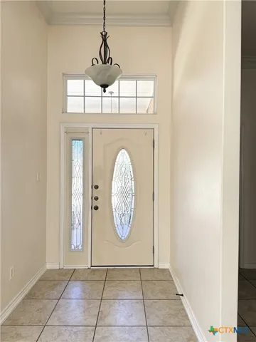 a view of a hallway with windows