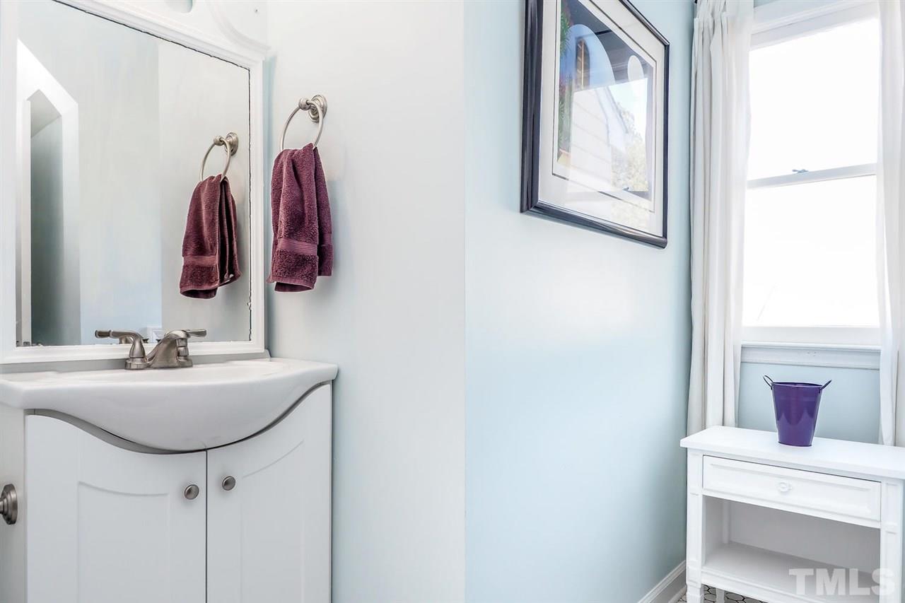 1713 Vintage Road Raleigh, NC 27610 - Photo 14 of 23 a bathroom with a sink and a mirror