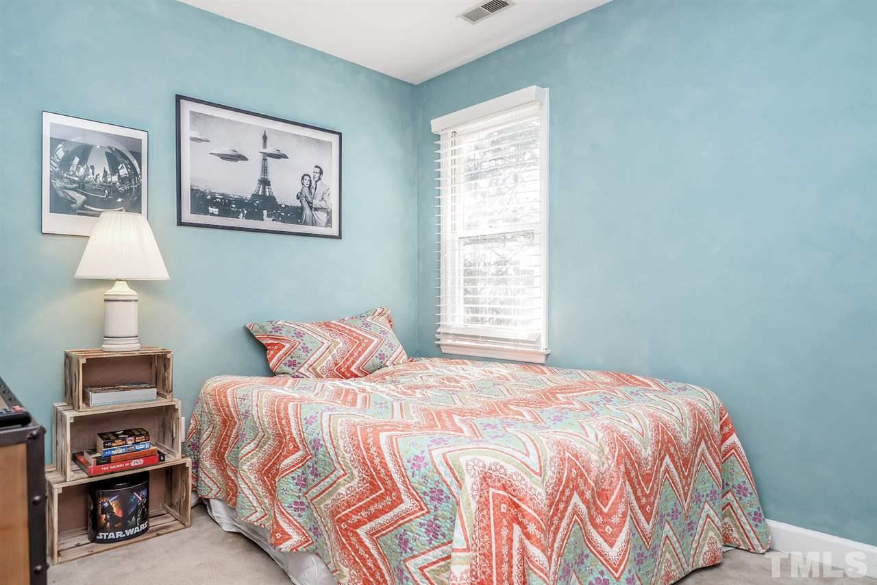 1713 Vintage Road Raleigh, NC 27610 - Photo 15 of 23 a bedroom with a bed and a window