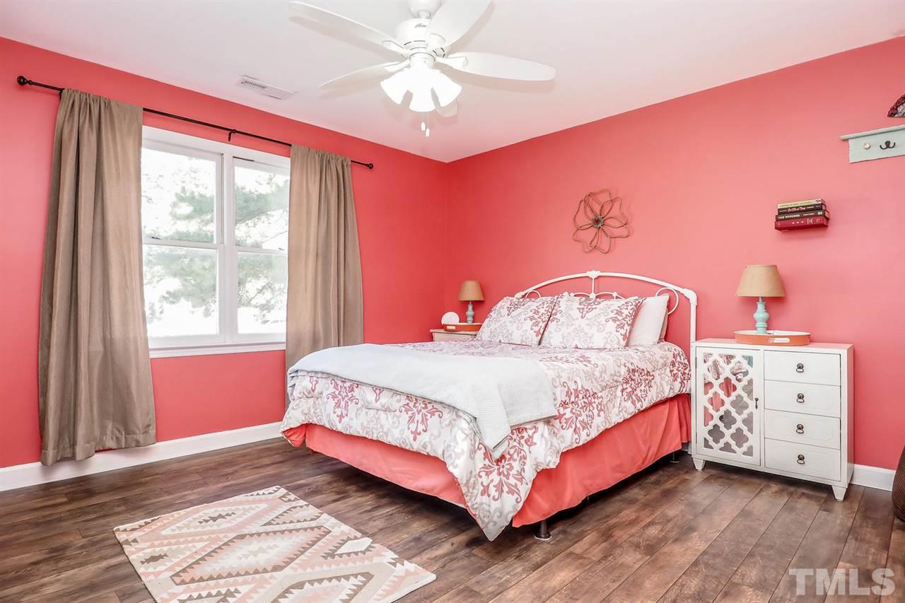 1713 Vintage Road Raleigh, NC 27610 - Photo 16 of 23 a bedroom with a bed and a window