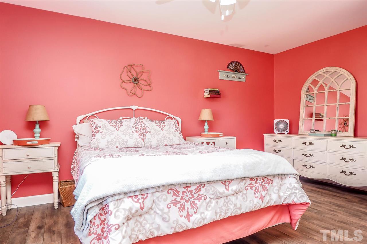 1713 Vintage Road Raleigh, NC 27610 - Photo 17 of 23 a bedroom with a bed and a dresser