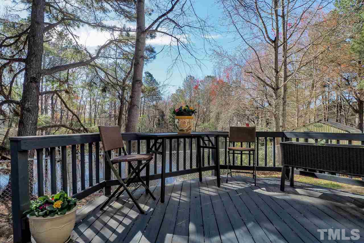 1713 Vintage Road Raleigh, NC 27610 - Photo 20 of 23 a view of a two chairs and table on the wooden floor