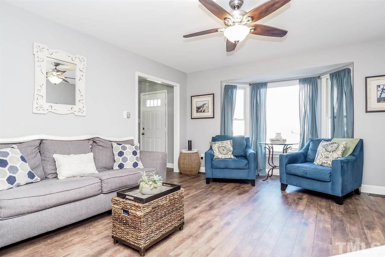 1713 Vintage Road Raleigh, NC 27610 - Photo 4 of 23 a living room with furniture and a large window