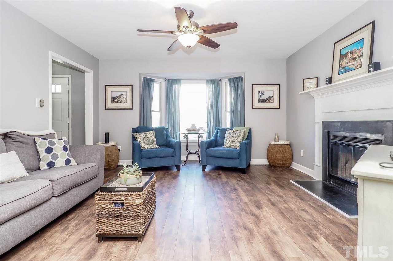 1713 Vintage Road Raleigh, NC 27610 - Photo 5 of 23 a living room with furniture and a fireplace
