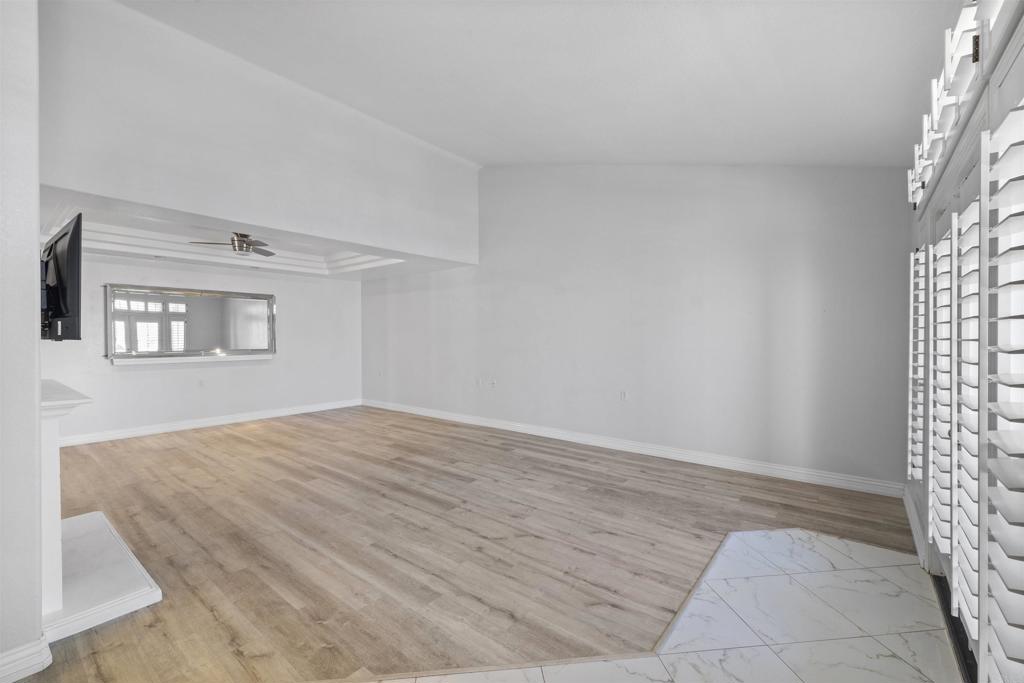 3355 Genoa Way, Unit 134 Oceanside, CA 92056 - Photo 14 of 45 a view of empty room with wooden floor and fan