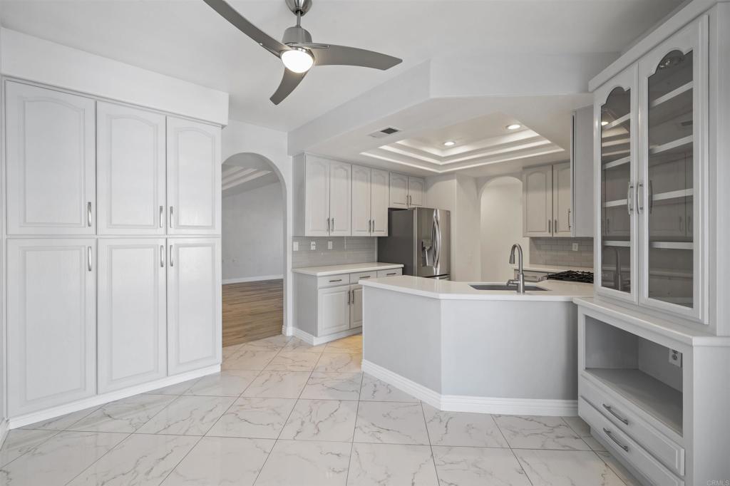 3355 Genoa Way, Unit 134 Oceanside, CA 92056 - Photo 19 of 45 a kitchen with white cabinets and white appliances
