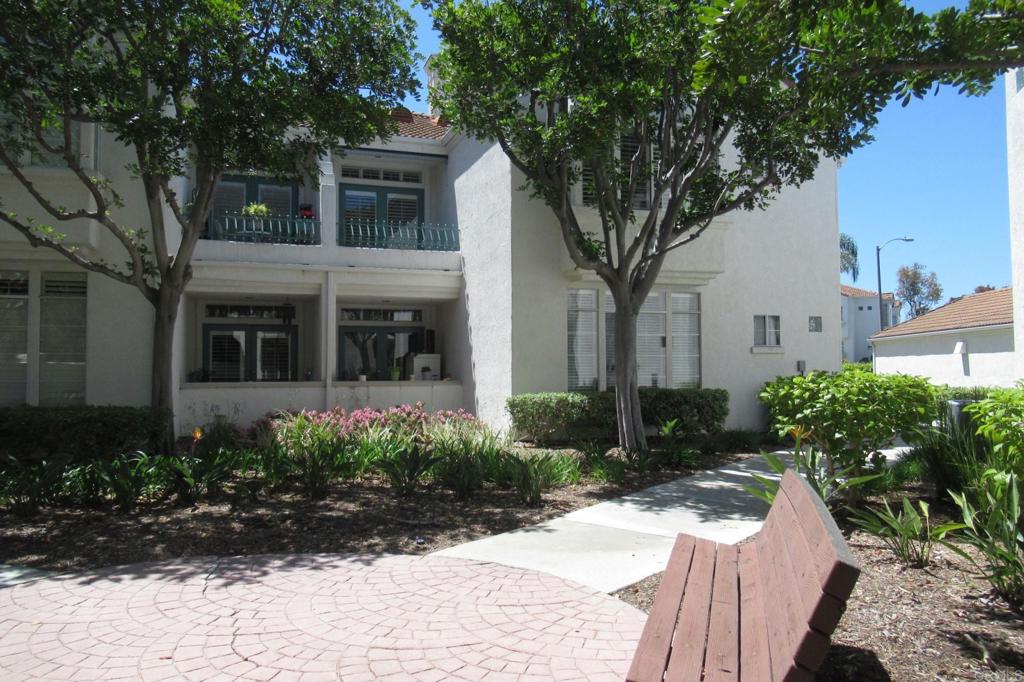 3355 Genoa Way, Unit 134 Oceanside, CA 92056 - Photo 26 of 45 a front view of a house with garden
