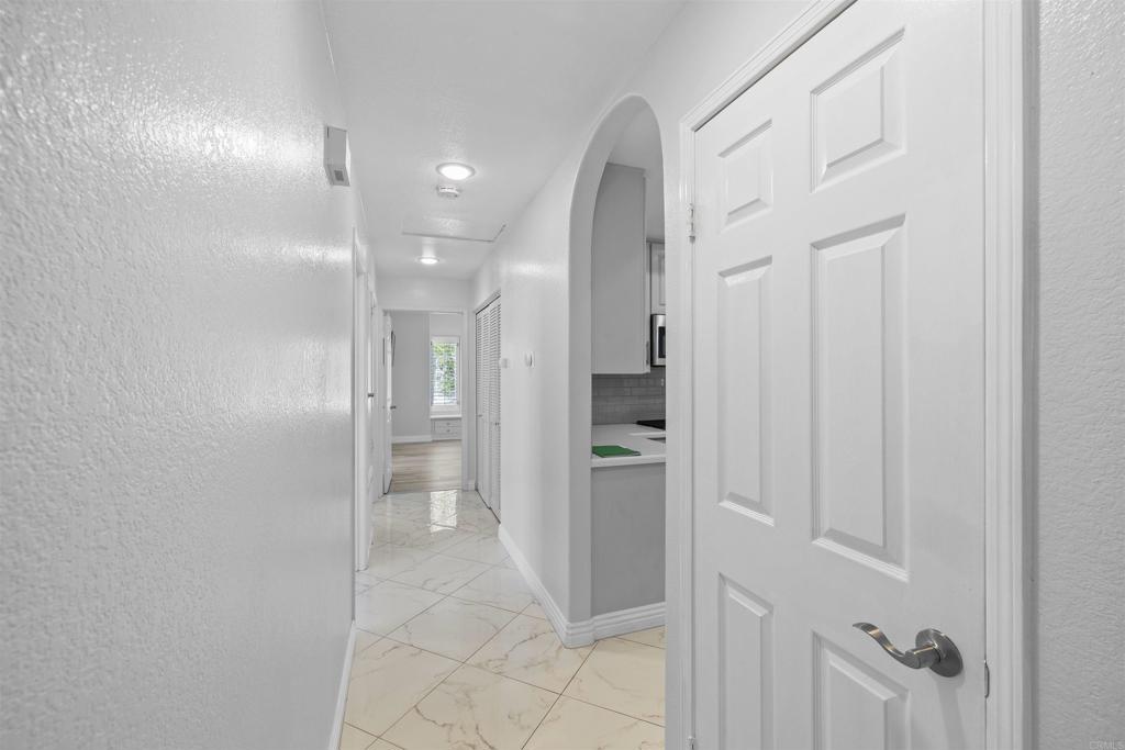 3355 Genoa Way, Unit 134 Oceanside, CA 92056 - Photo 27 of 45 a bathroom with a shower and a glass door