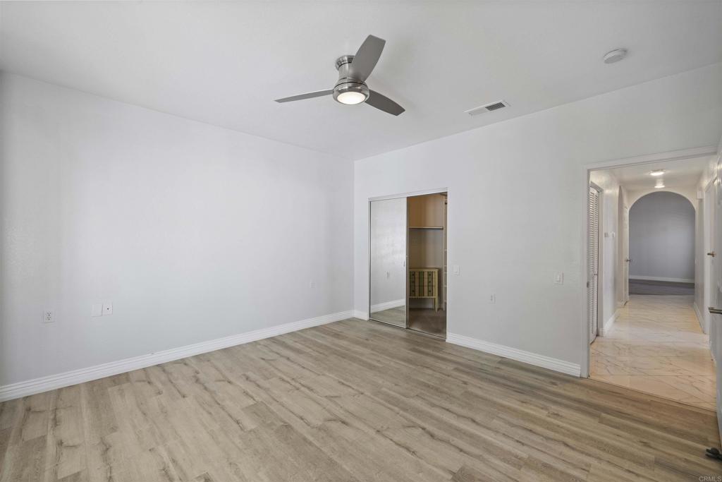 3355 Genoa Way, Unit 134 Oceanside, CA 92056 - Photo 33 of 45 wooden floor in an empty room with a window