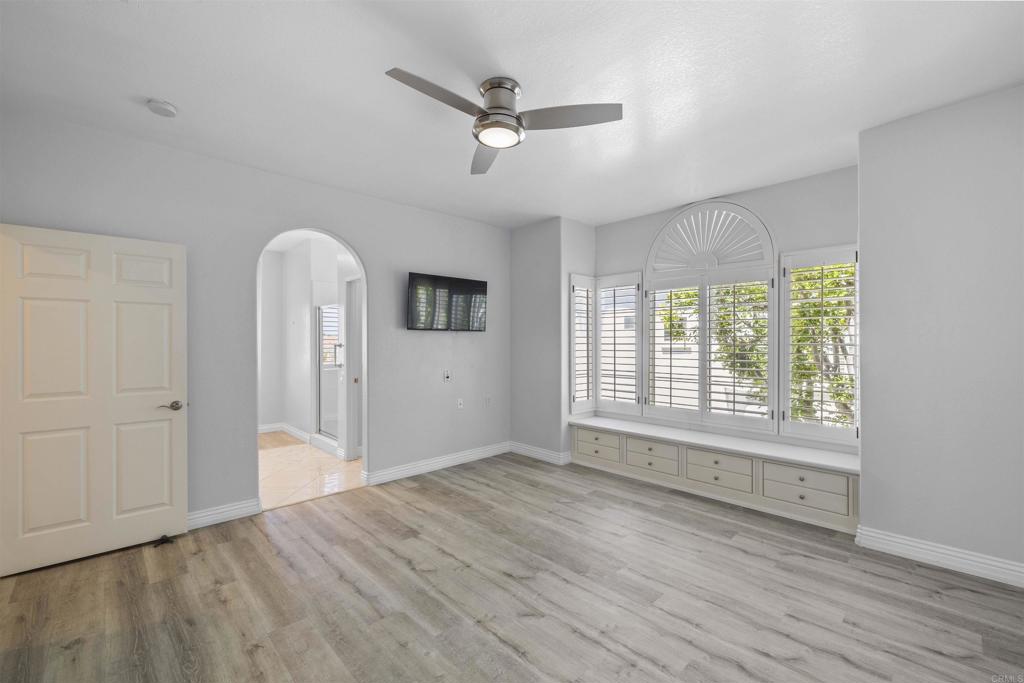 3355 Genoa Way, Unit 134 Oceanside, CA 92056 - Photo 36 of 45 a view of an empty room with a window and wooden floor