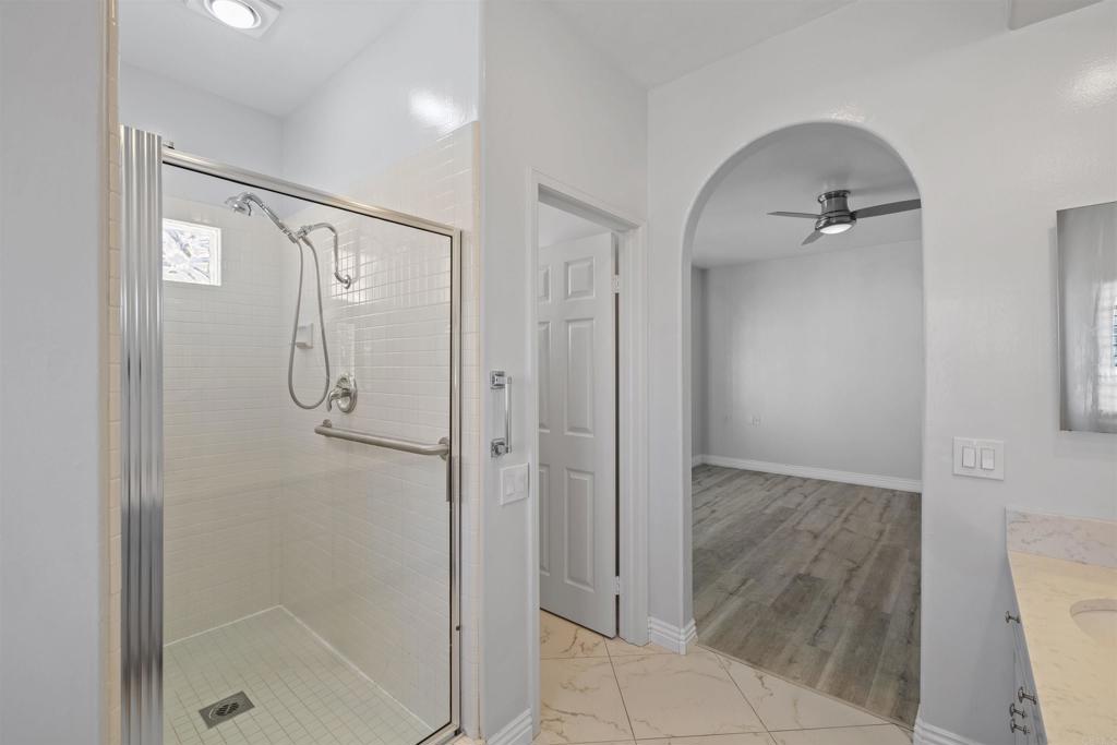 3355 Genoa Way, Unit 134 Oceanside, CA 92056 - Photo 37 of 45 a bathroom with a shower and a sink