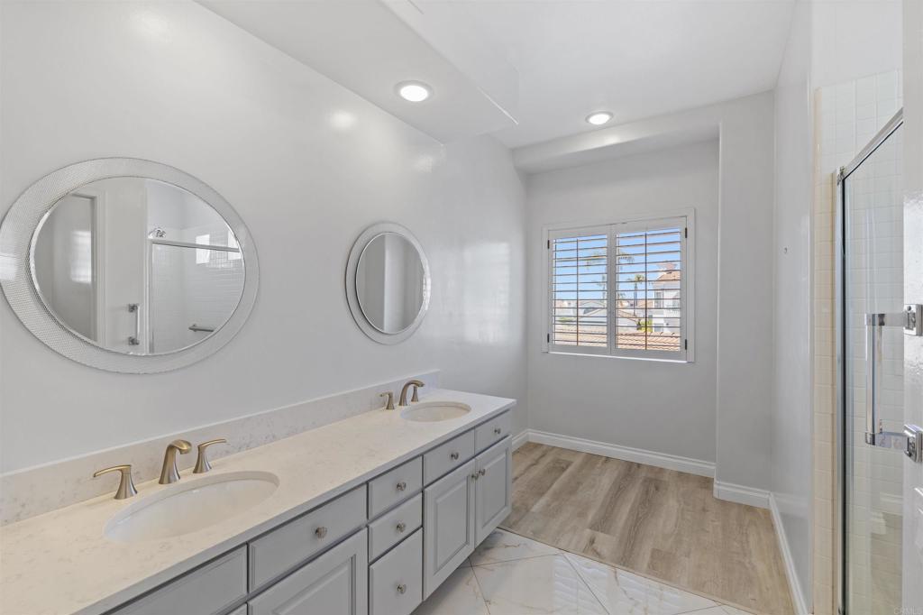 3355 Genoa Way, Unit 134 Oceanside, CA 92056 - Photo 38 of 45 a spacious bathroom with 2 sink and a mirror