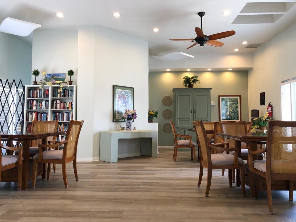 3355 Genoa Way, Unit 134 Oceanside, CA 92056 - Photo 45 of 45 a view of a a dining room with furniture window and wooden floor