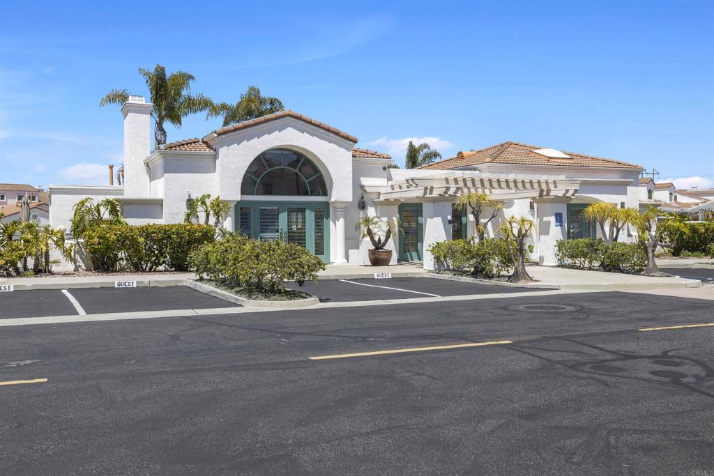 3355 Genoa Way, Unit 134 Oceanside, CA 92056 - Photo 8 of 45 a front view of a house with a garden