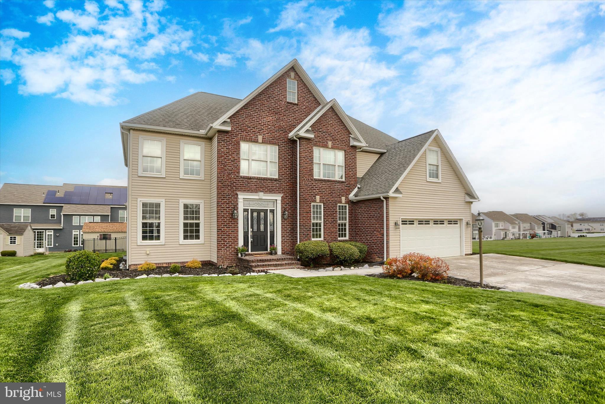 10 Spring View Court Mechanicsburg, PA 17050 - Photo 1 of 50 a front view of a house with a yard and trees