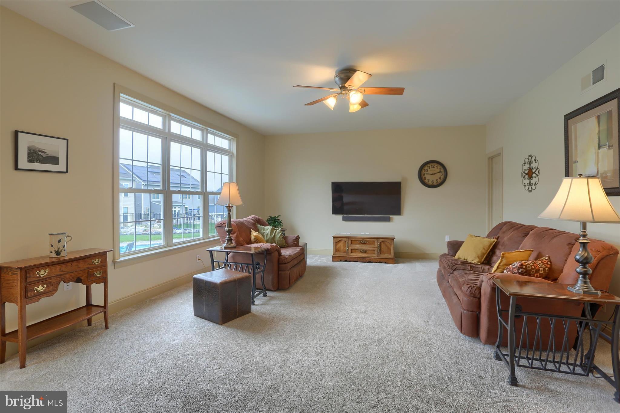 10 Spring View Court Mechanicsburg, PA 17050 - Photo 17 of 50 a living room with furniture and a flat screen tv
