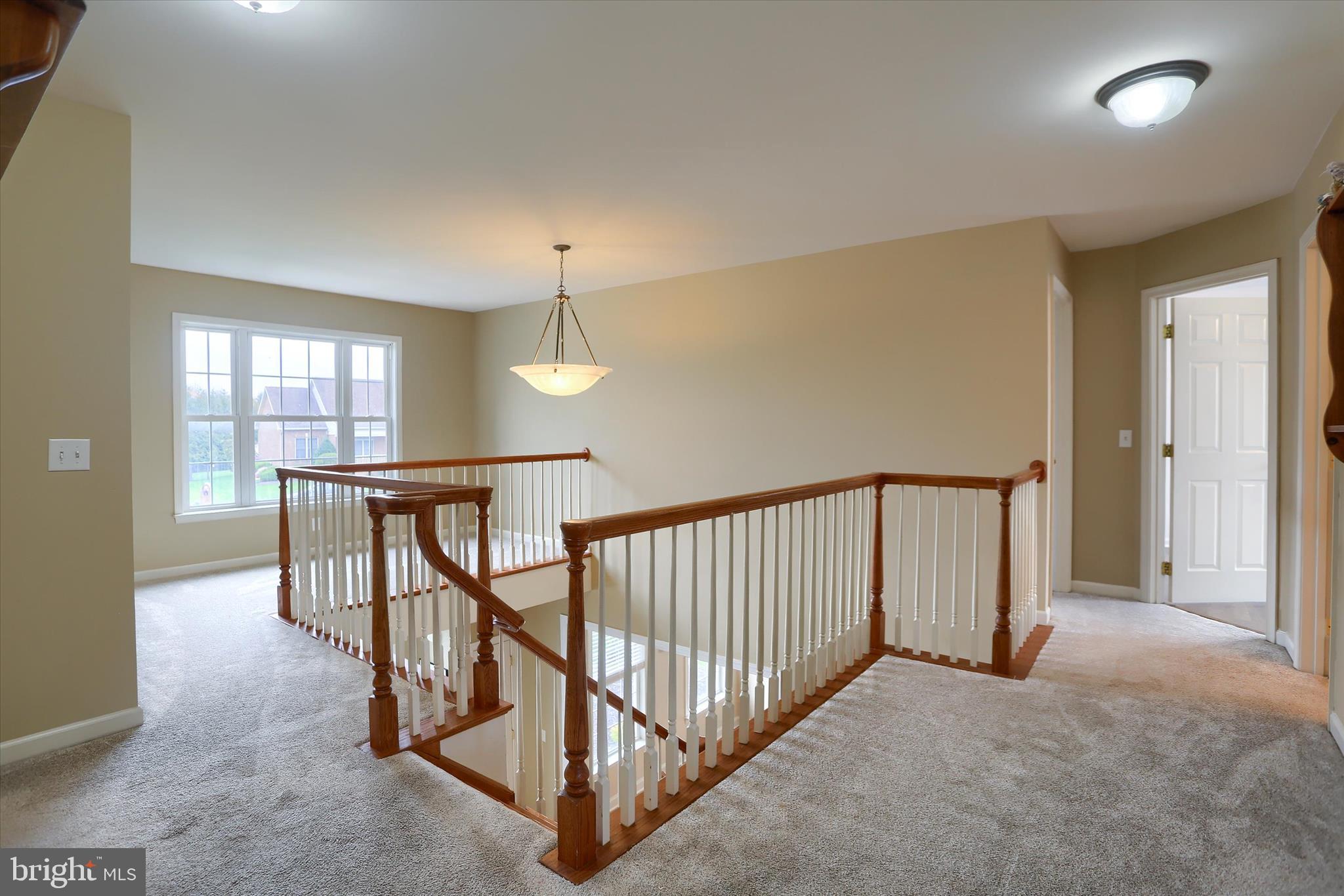 10 Spring View Court Mechanicsburg, PA 17050 - Photo 23 of 50 an empty room with windows & a chandelier