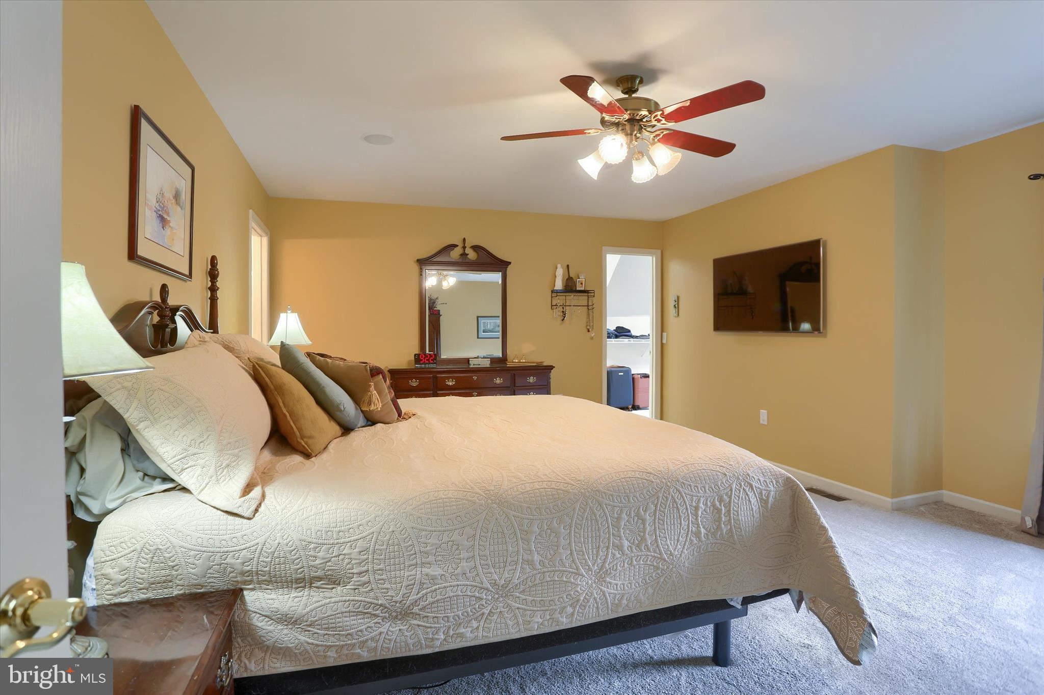 10 Spring View Court Mechanicsburg, PA 17050 - Photo 30 of 50 a bedroom with a bed and a chandelier