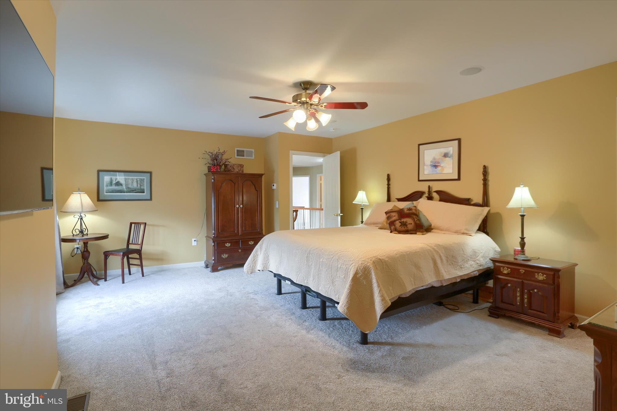 10 Spring View Court Mechanicsburg, PA 17050 - Photo 31 of 50 a bedroom with a bed and a chandelier