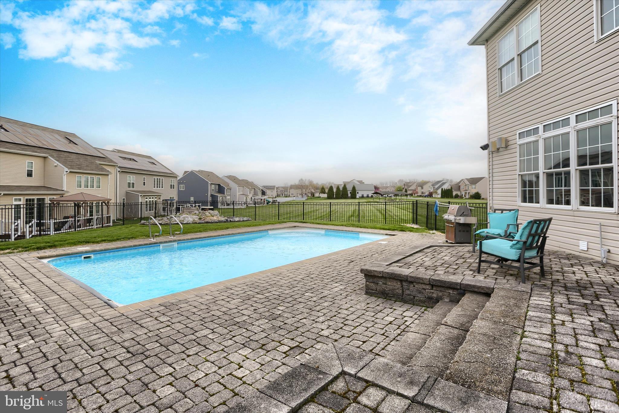 10 Spring View Court Mechanicsburg, PA 17050 - Photo 43 of 50 a view of a swimming pool with a lounge chair