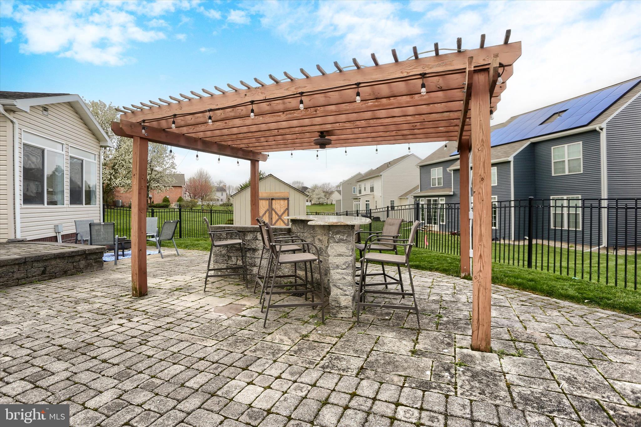 10 Spring View Court Mechanicsburg, PA 17050 - Photo 46 of 50 a view of a patio with a table and chairs next to a yard