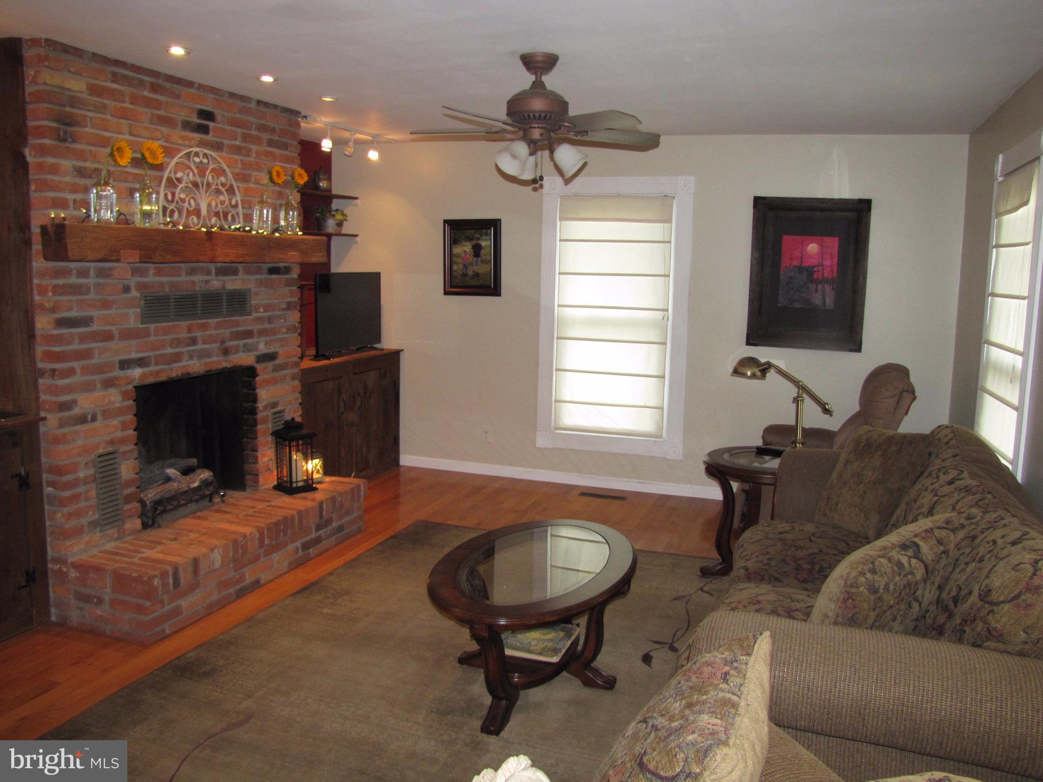234 Weaver Meadows Road Conowingo, MD 21918 - Photo 6 of 20 Family Room with Fireplace & Book Cases