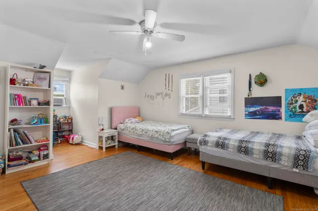 a bedroom with a bed and a couch