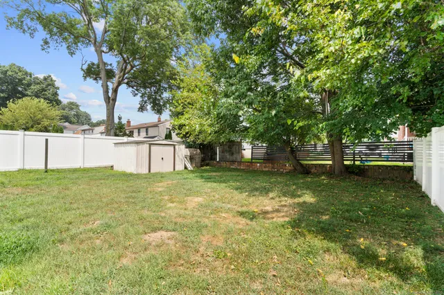 a backyard of a house with lots of green space