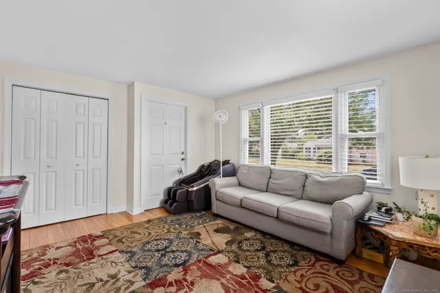 a bedroom with furniture and a window