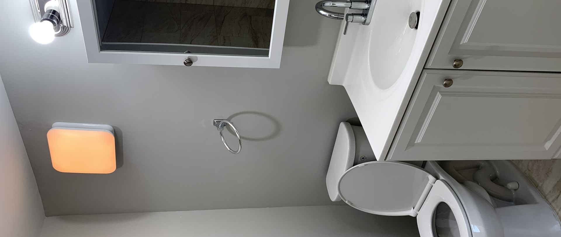 8141 84th Place, Unit 1D Justice, IL 60458 - Photo 15 of 18 a bathroom with a granite countertop sink and a mirror