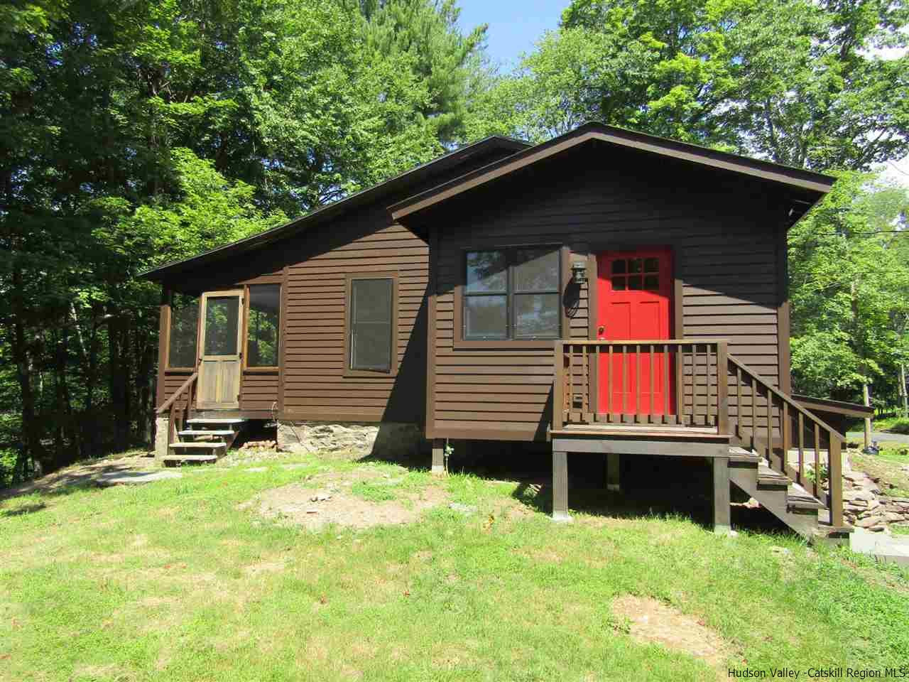 64 Macdaniel Road Woodstock, NY 12498 - Photo 1 of 35 a front view of a house with a yard