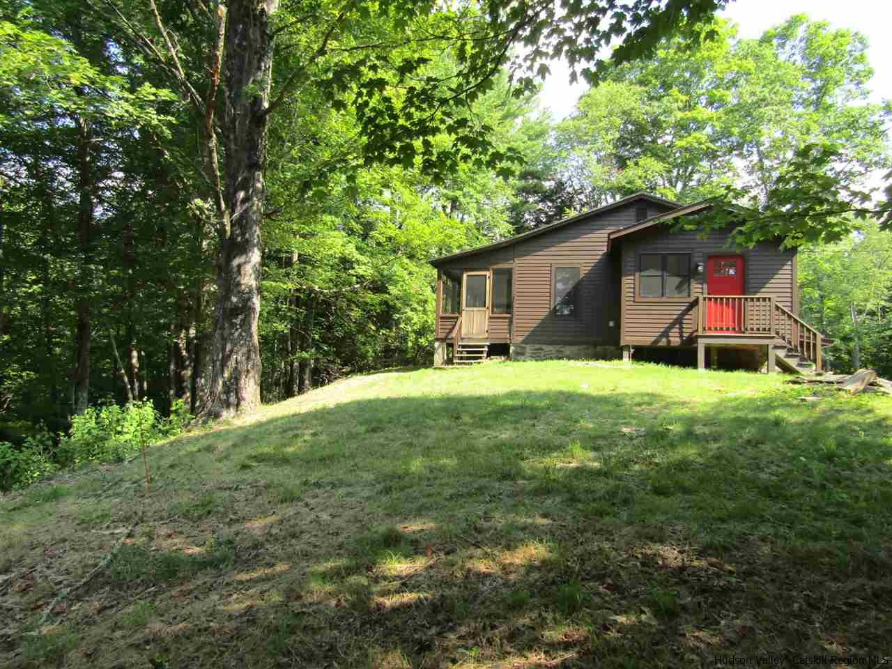 64 Macdaniel Road Woodstock, NY 12498 - Photo 3 of 35 a view of a backyard with a small cabin