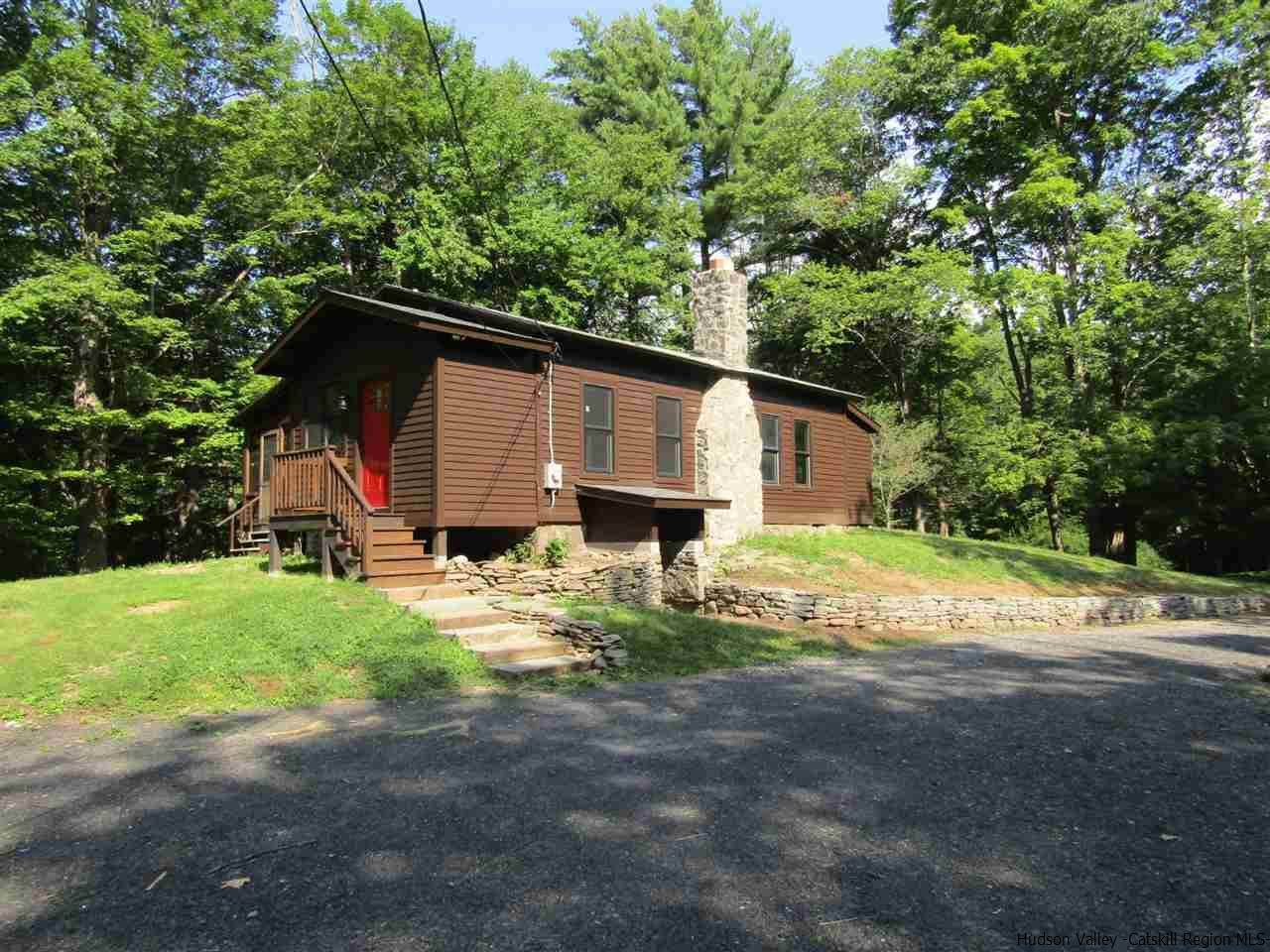 64 Macdaniel Road Woodstock, NY 12498 - Photo 4 of 35 a view of backyard of house with wooden fence and trees