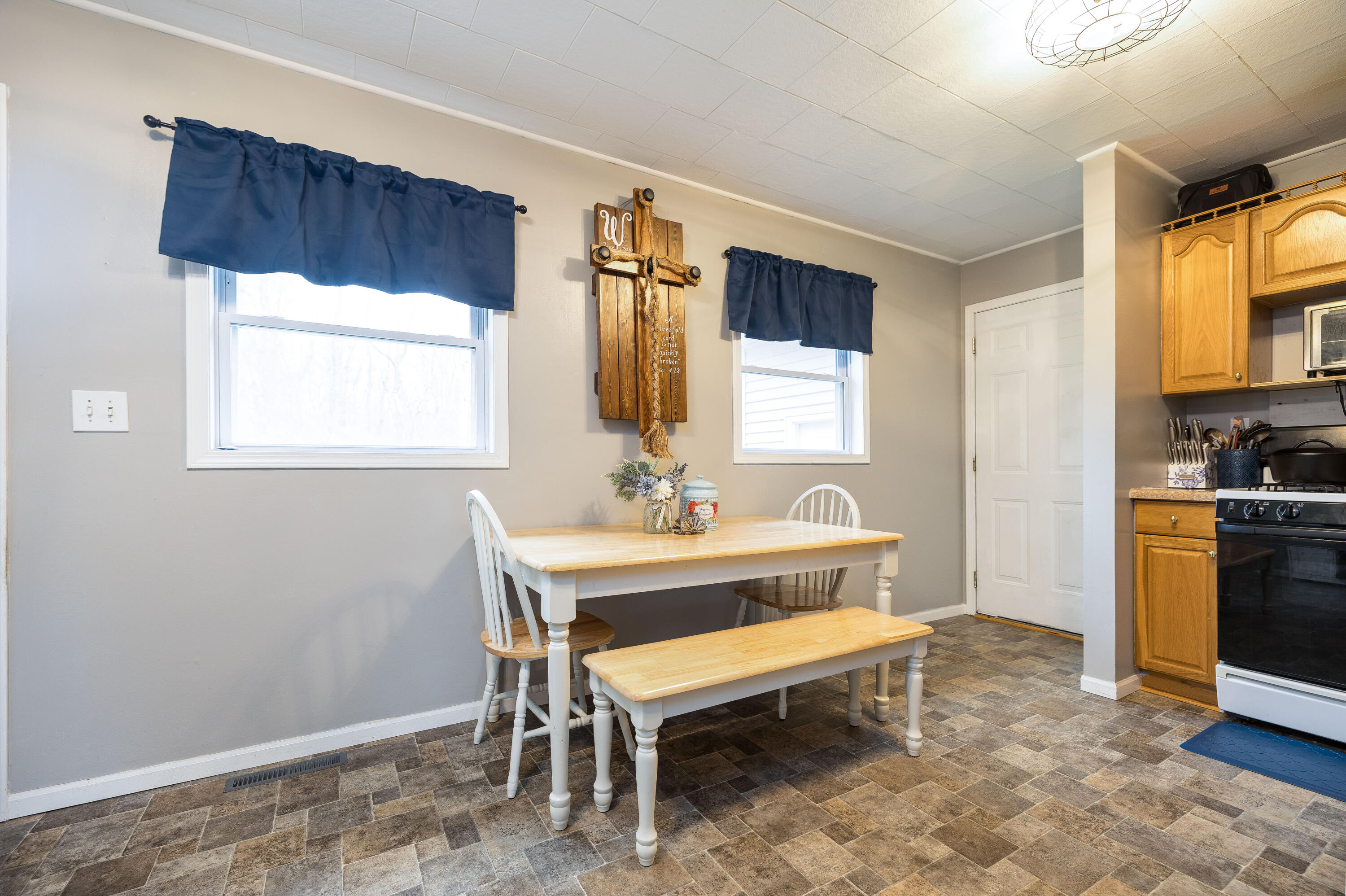 7612 Graefen Drive Demotte, IN 46310 - Photo 13 of 25 a view of a room that has a couch and a stove in it