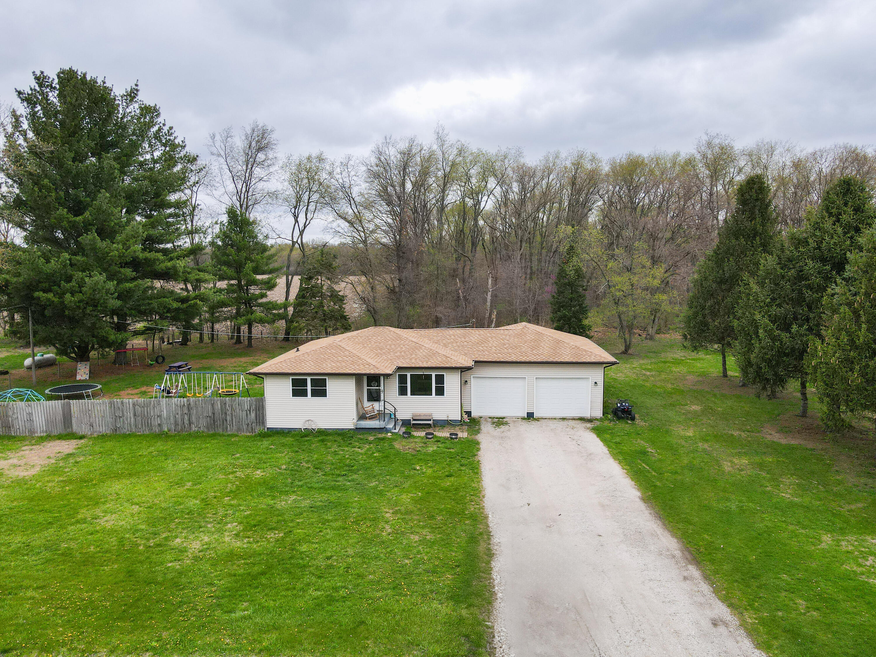 7612 Graefen Drive Demotte, IN 46310 - Photo 23 of 25 a view of a house with a yard and sitting area