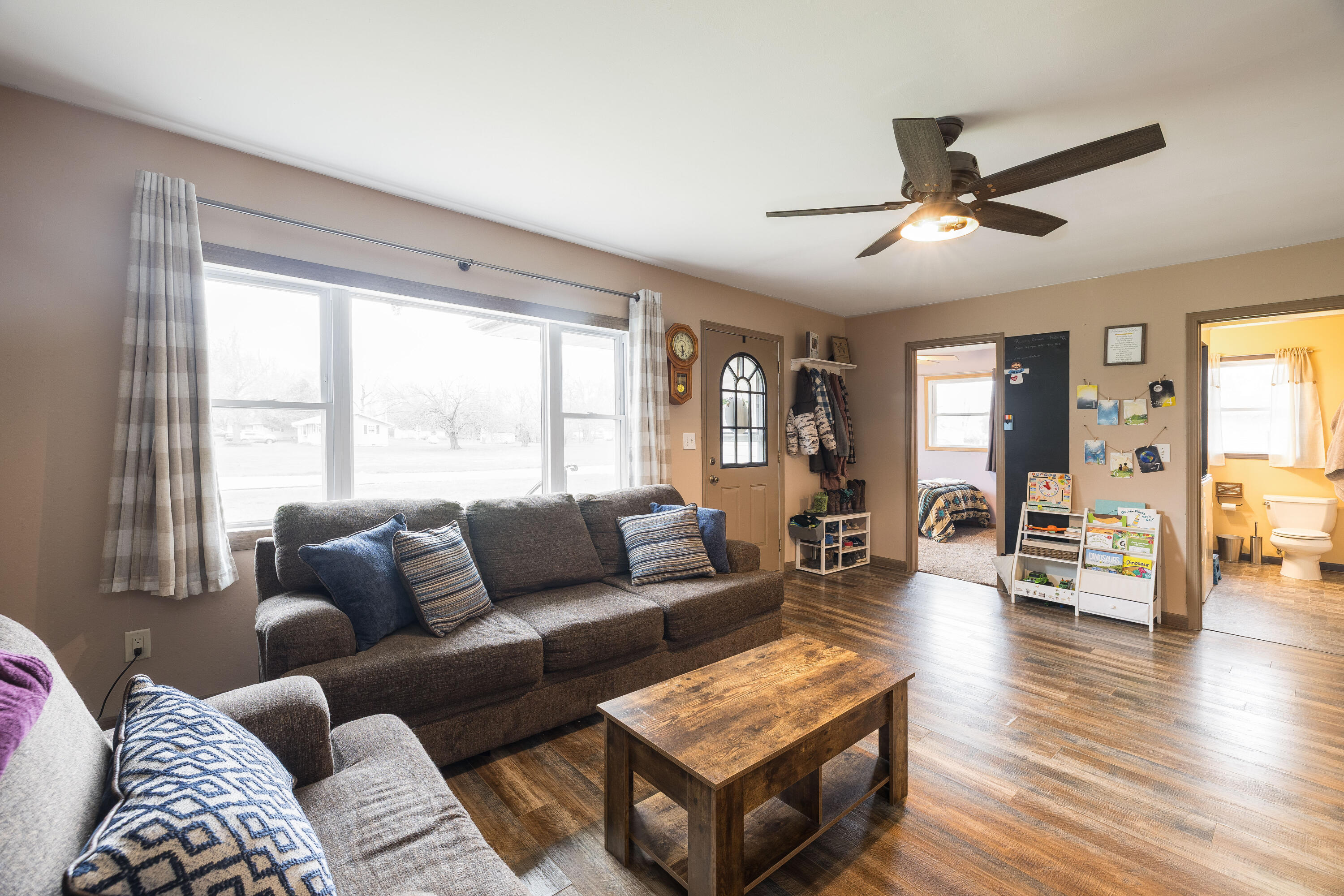 7612 Graefen Drive Demotte, IN 46310 - Photo 6 of 25 a living room with furniture and a large window