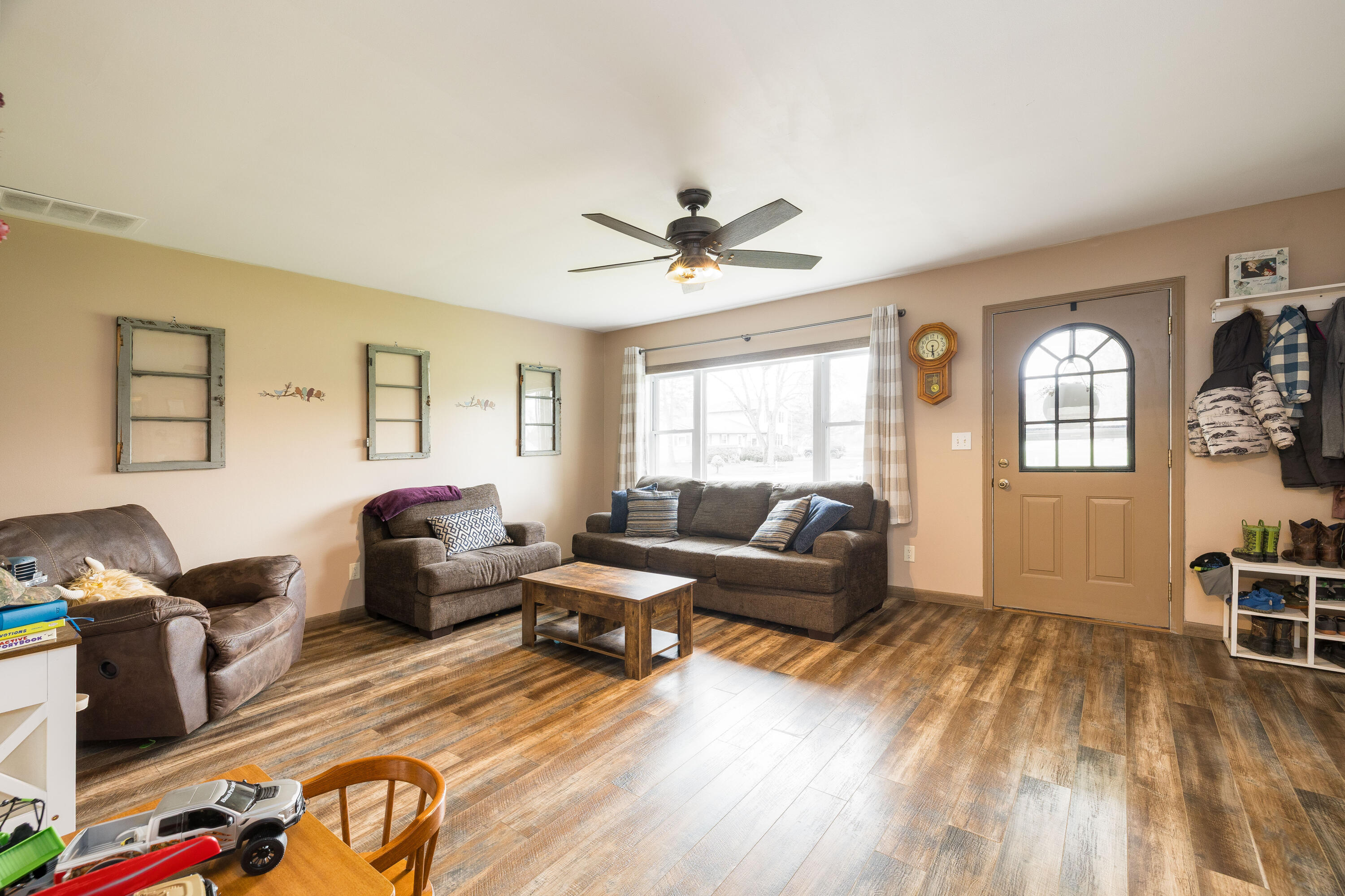 7612 Graefen Drive Demotte, IN 46310 - Photo 7 of 25 a living room with furniture and wooden floor