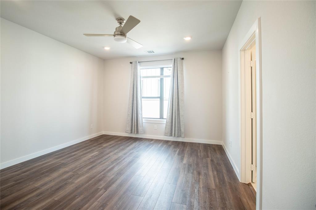 2348 Rook Drive Dallas, TX 75211 - Photo 13 of 21 an empty room with wooden floor and windows
