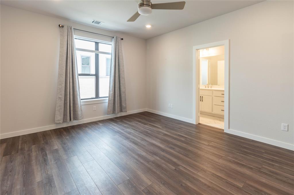 2348 Rook Drive Dallas, TX 75211 - Photo 14 of 21 an empty room with wooden floor and windows