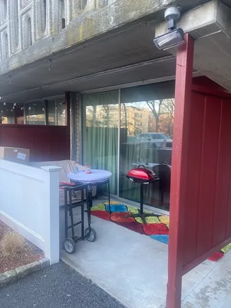 a table and chairs in front of a building
