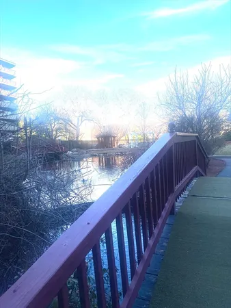 a view of a balcony with wooden fence