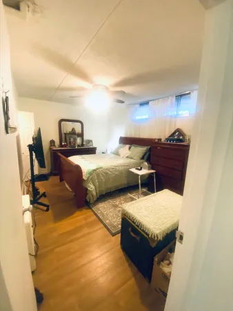 a bedroom with two beds and painted walls