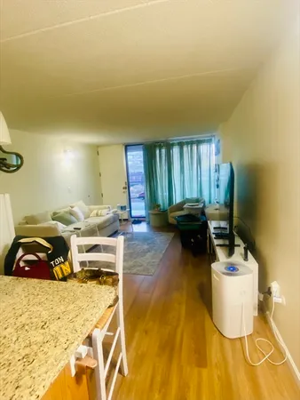 a bedroom with a bed and a chair